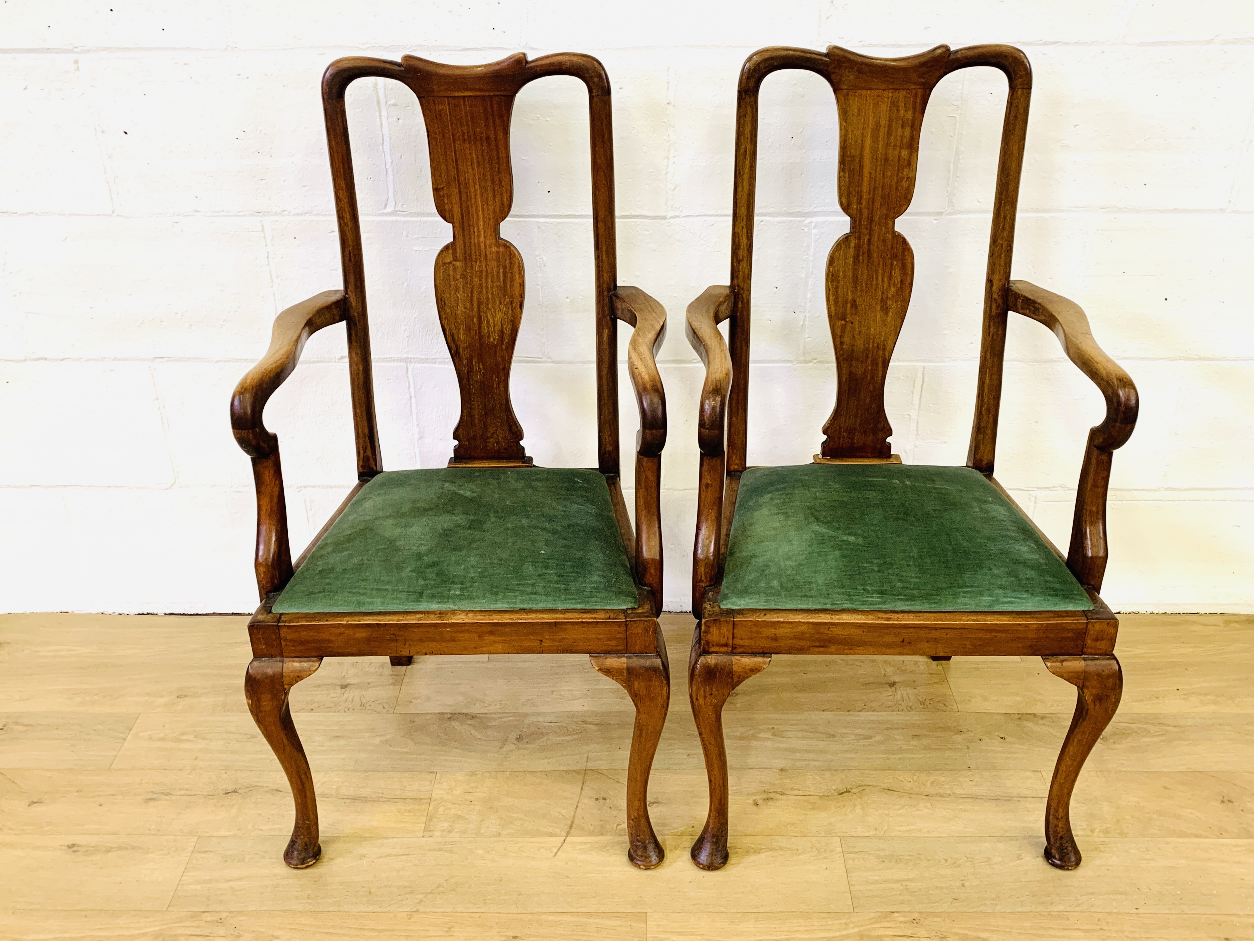 Two mahogany elbow chairs