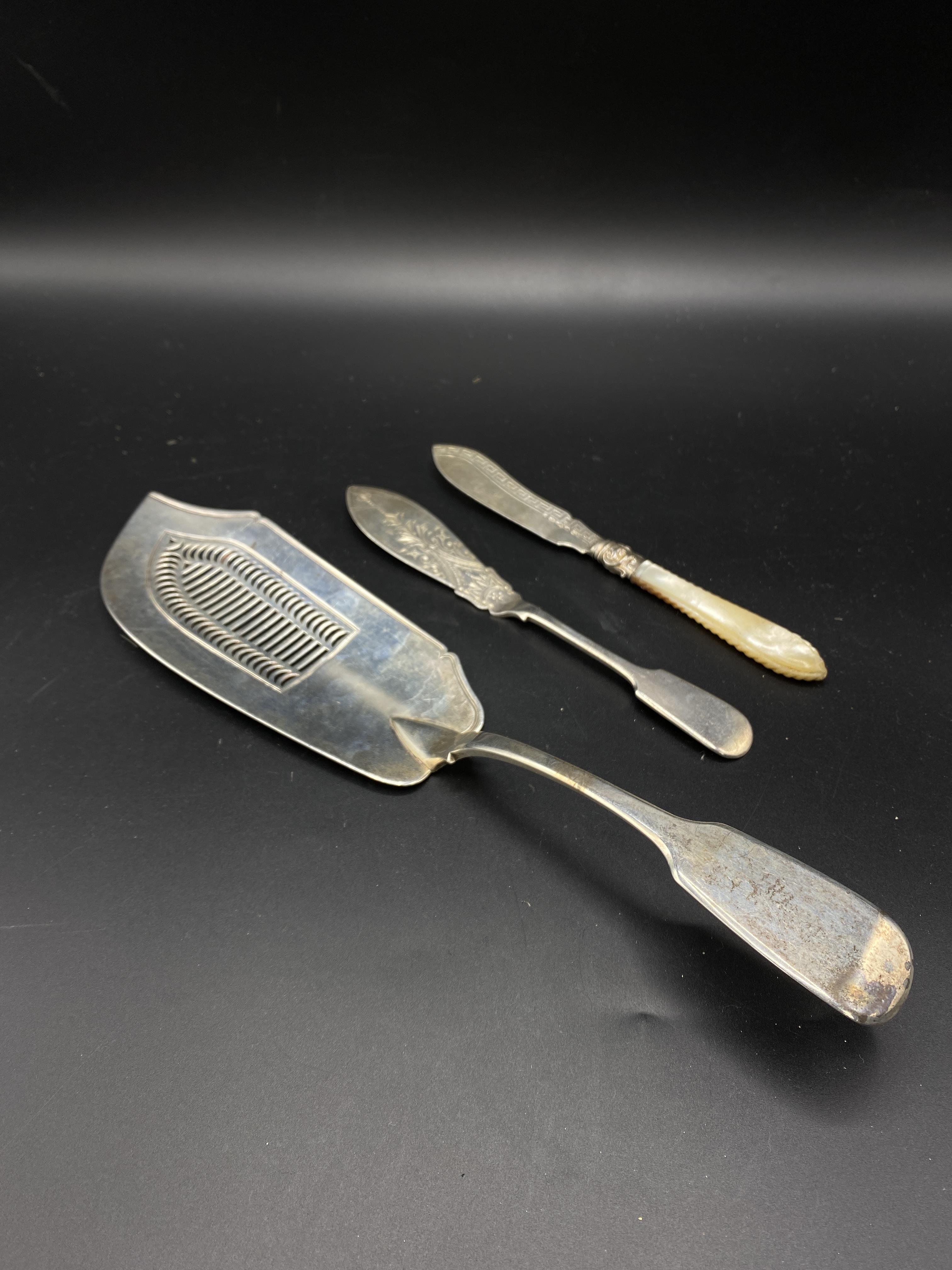Silver fish slice and server together with a knife with mother of pearl handle