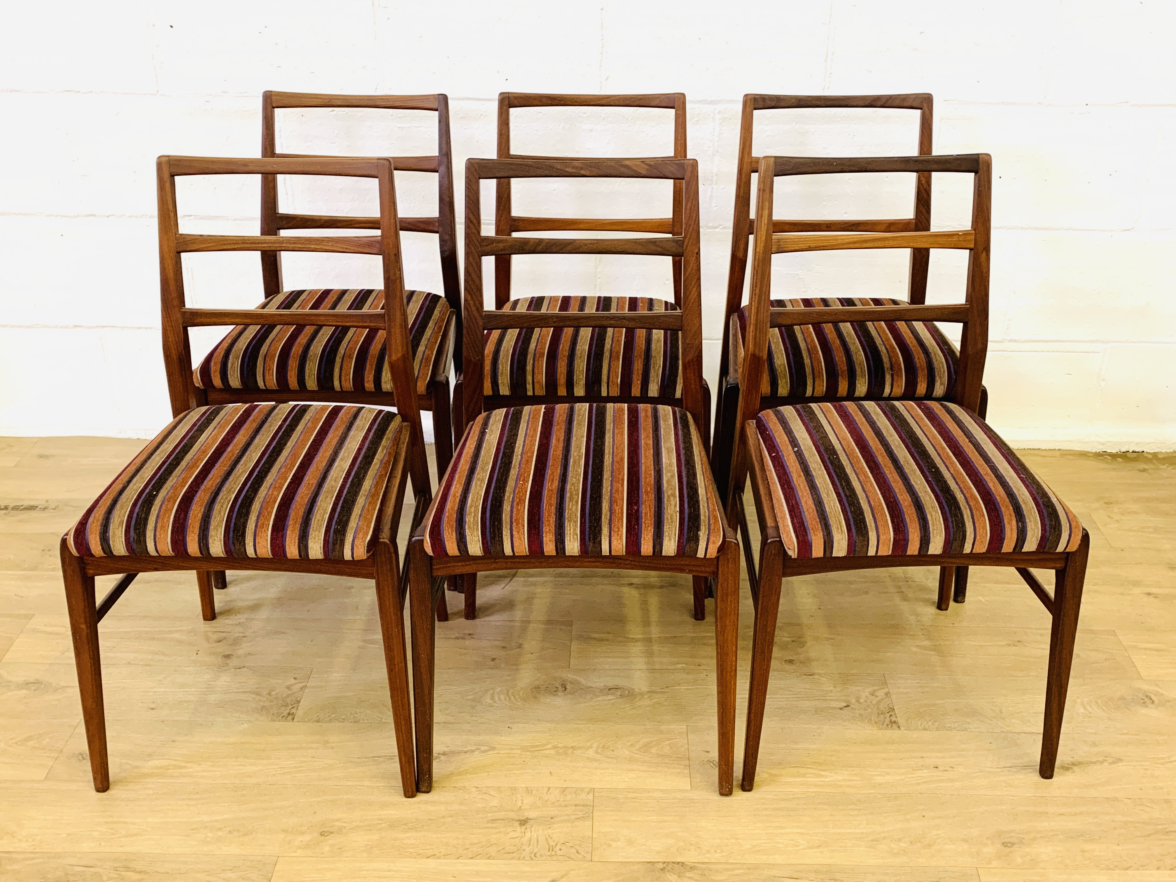 Six teak dining chairs