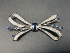 18ct white gold, sapphire and diamond bow brooch