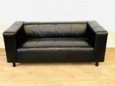 Black leather two seat sofa