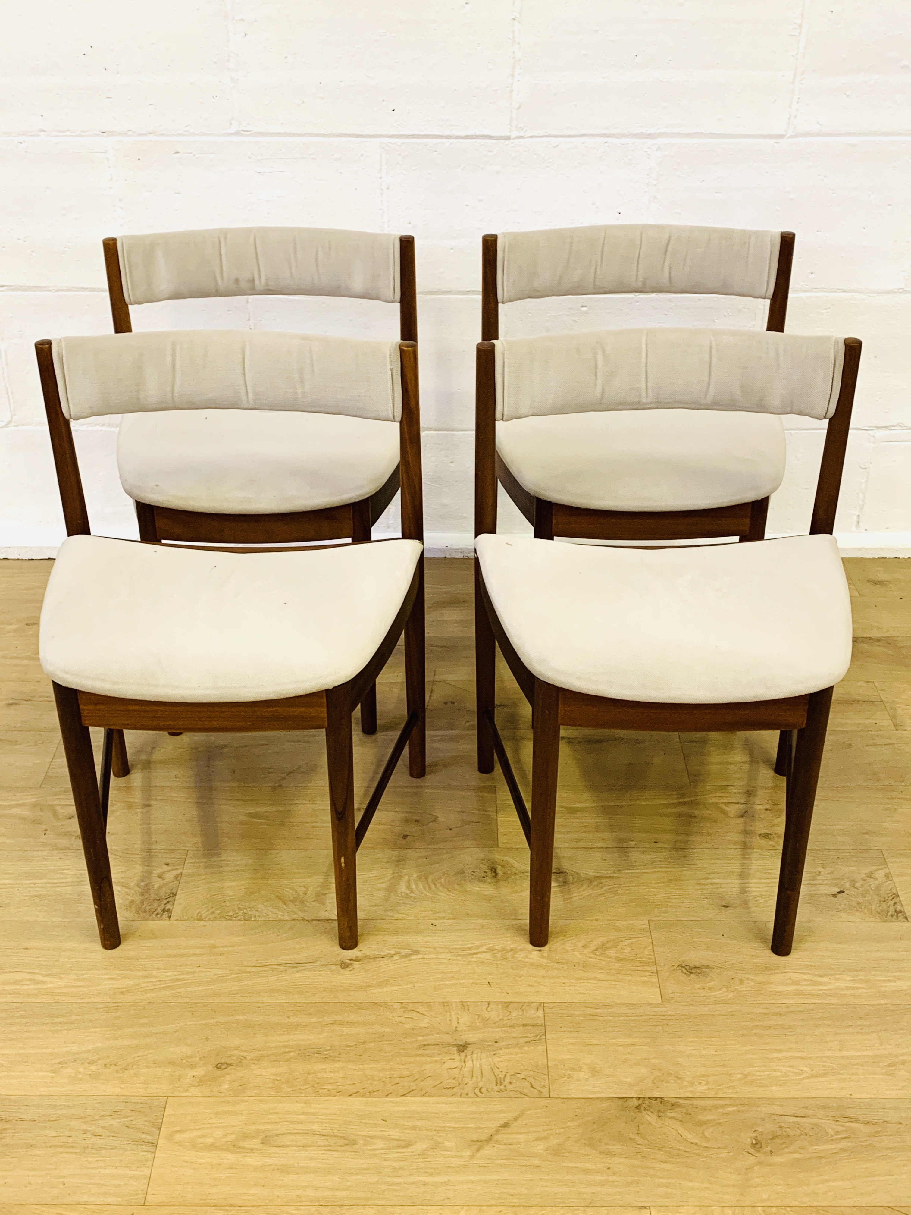 Four teak dining chairs