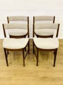 Four teak dining chairs