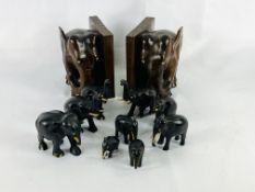 Carved rosewood bookends together with carved wood elephants