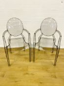 Two Kartell clear plastic armchairs