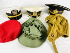 A collection of military caps