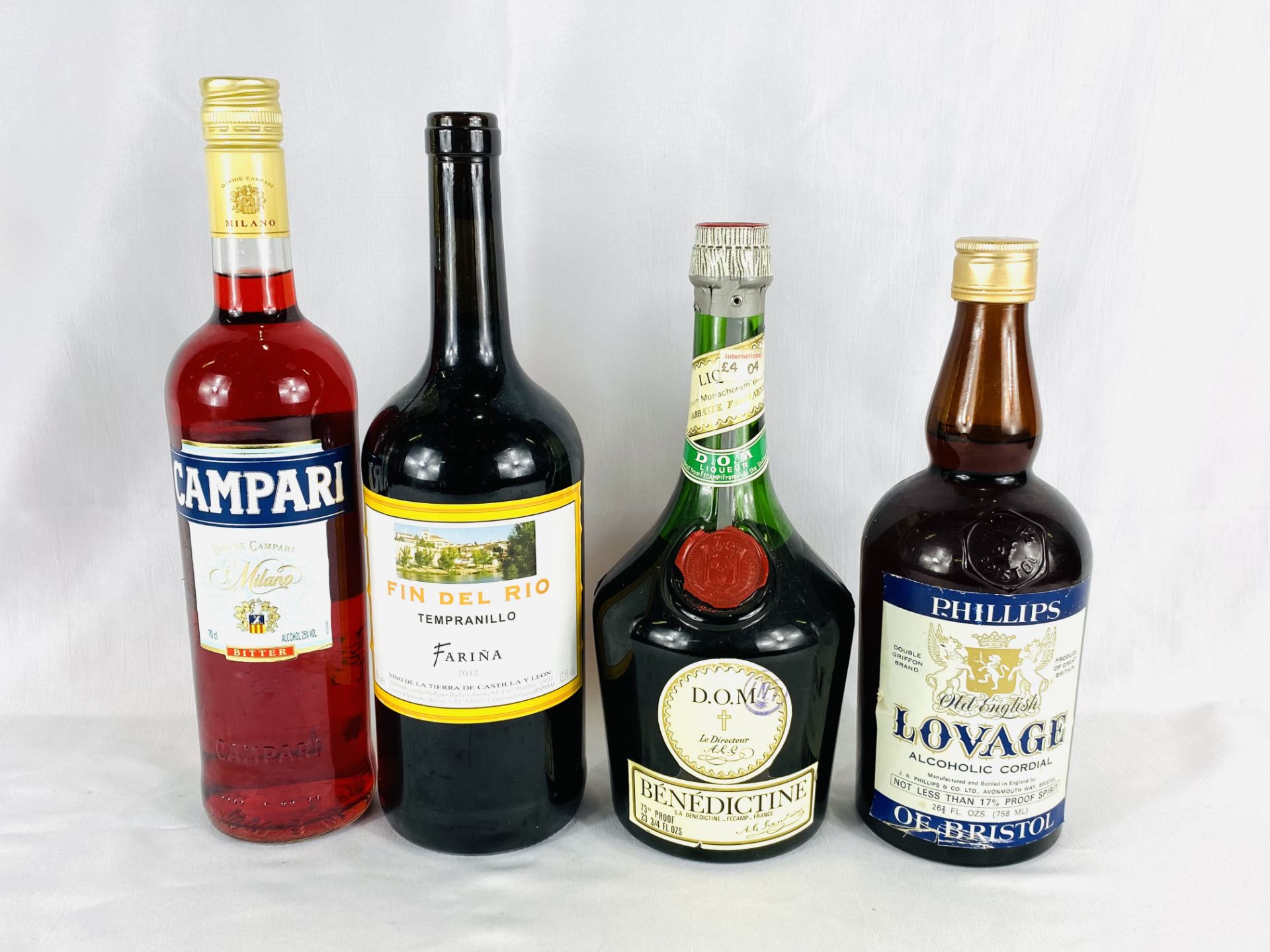 Bottle of Benedictine; Campari; Fin De Río Tempranillo; Old English Loveage.