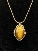 9ct gold tigers eye pendant on a 9ct gold chain