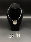 Silver necklace together with two pairs of silver earrings