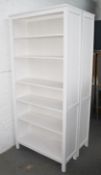 A Pair Of Tall 5-Shelf Display Units In A Light Off White Finish