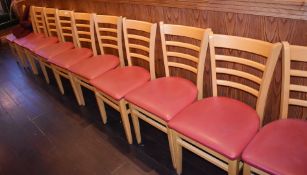 11 x Restaurant Dining Chairs With A Light Wood Finish and Red Faux Leather Seat Pads