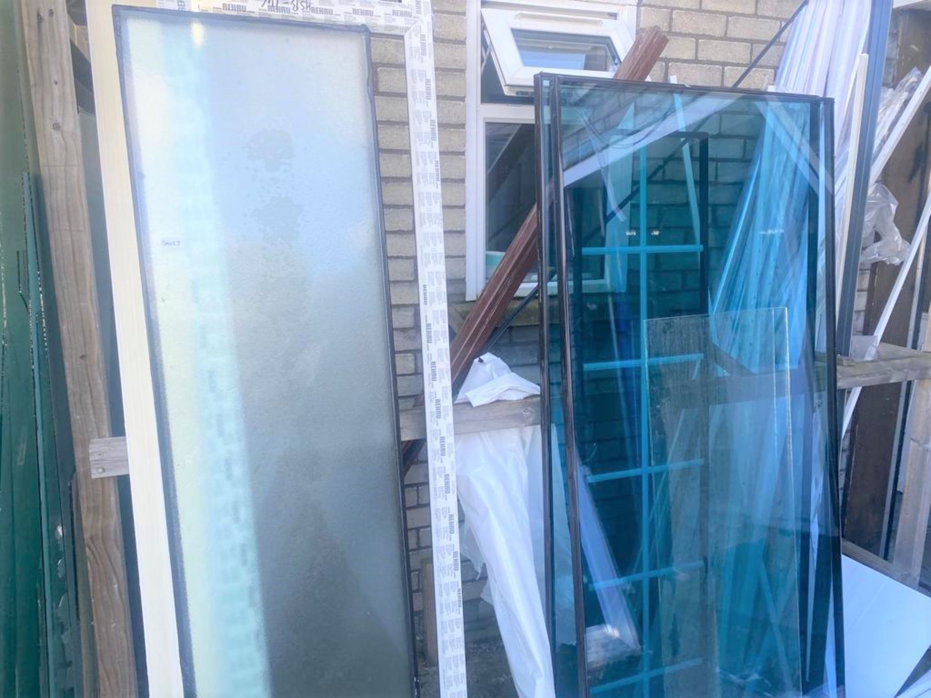 Quantity of Glass, UPVC Window Frames, Decorative Strips and Complete Double Glazing Units -