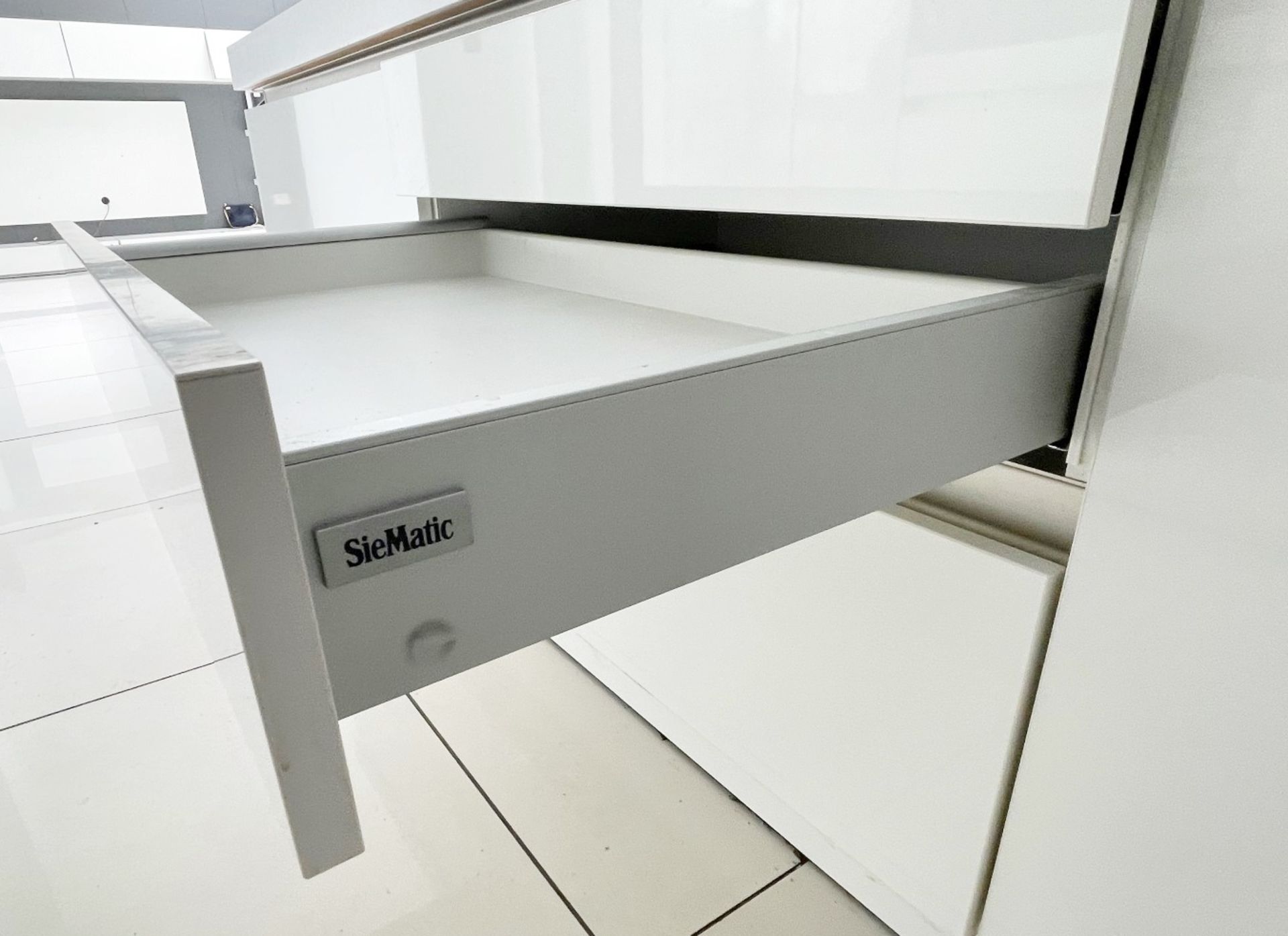 1 x SieMatic Contemporary Fitted Kitchen With Branded Appliances, Central Island + Corian Worktops - Image 50 of 100