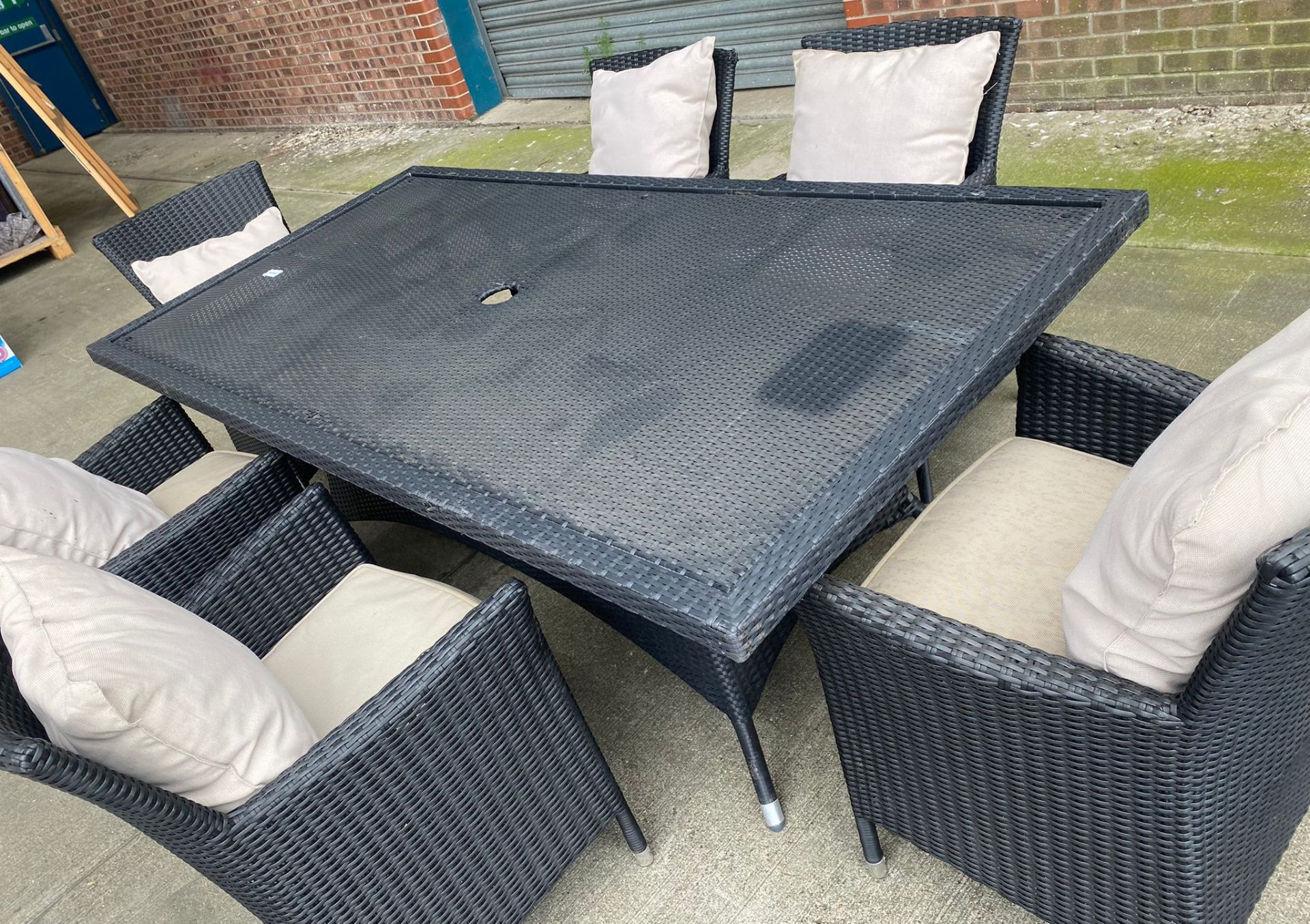 1 x Dark Rattan Outdoor Table With Six Chairs and Cushions