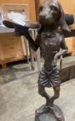 1 x Bronze Dog Sculpture - Standing Clothed Dog Holding Hat - Size: 1150mm Tall