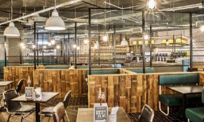 Large Seating Booth Area Featuring Rustic Wood Dividers Under Industrial Style Height Extenders