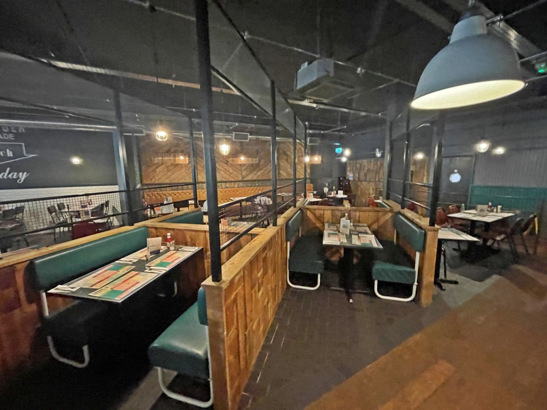 Large Seating Booth Area Featuring Rustic Wood Dividers Under Industrial Style Height Extenders - Image 21 of 27