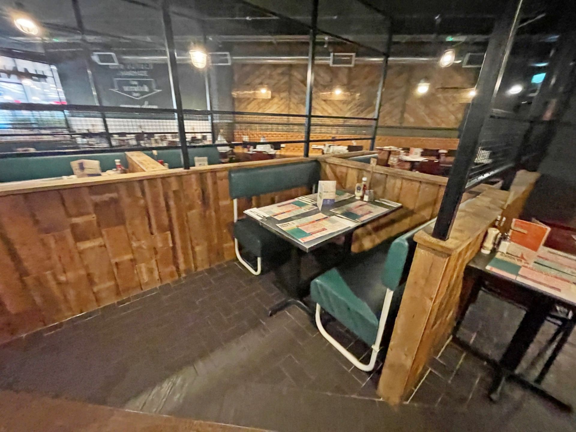 Large Seating Booth Area Featuring Rustic Wood Dividers Under Industrial Style Height Extenders - Image 19 of 27