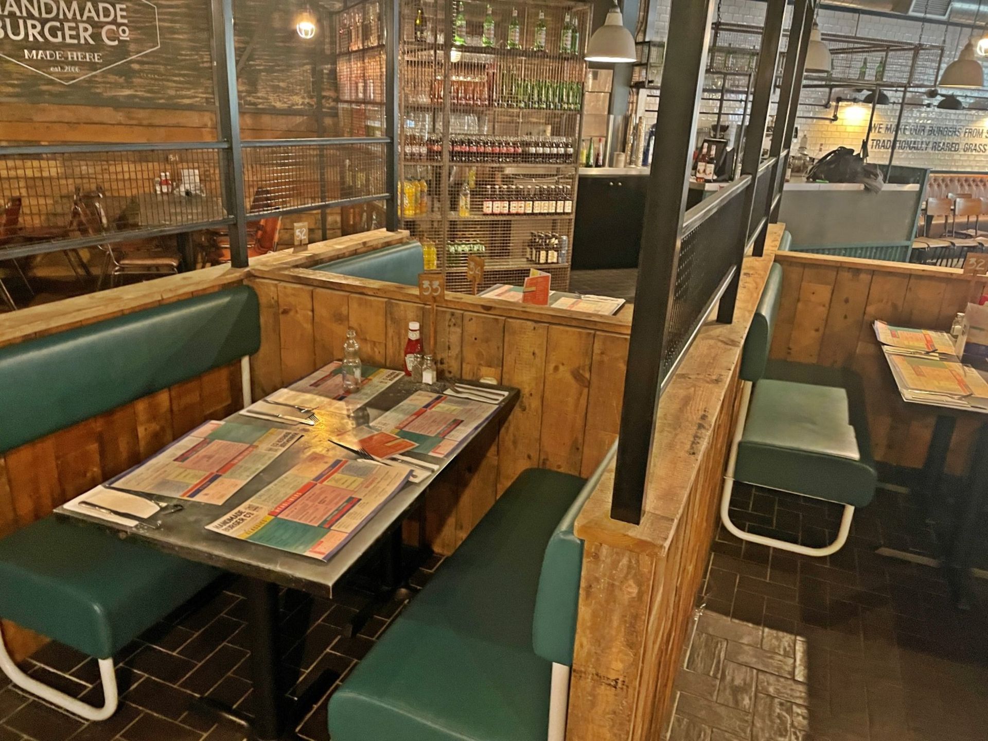 Large Seating Booth Area Featuring Rustic Wood Dividers Under Industrial Style Height Extenders - Image 14 of 27