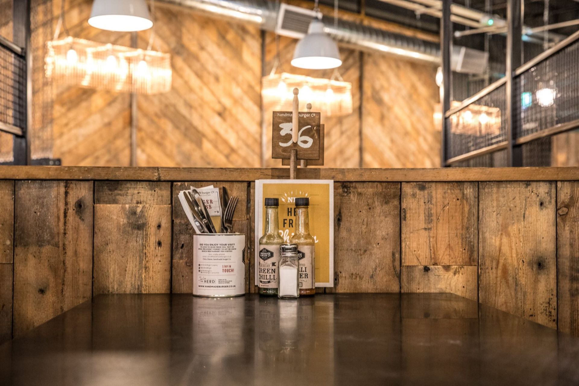 Large Seating Booth Area Featuring Rustic Wood Dividers Under Industrial Style Height Extenders - Image 3 of 27