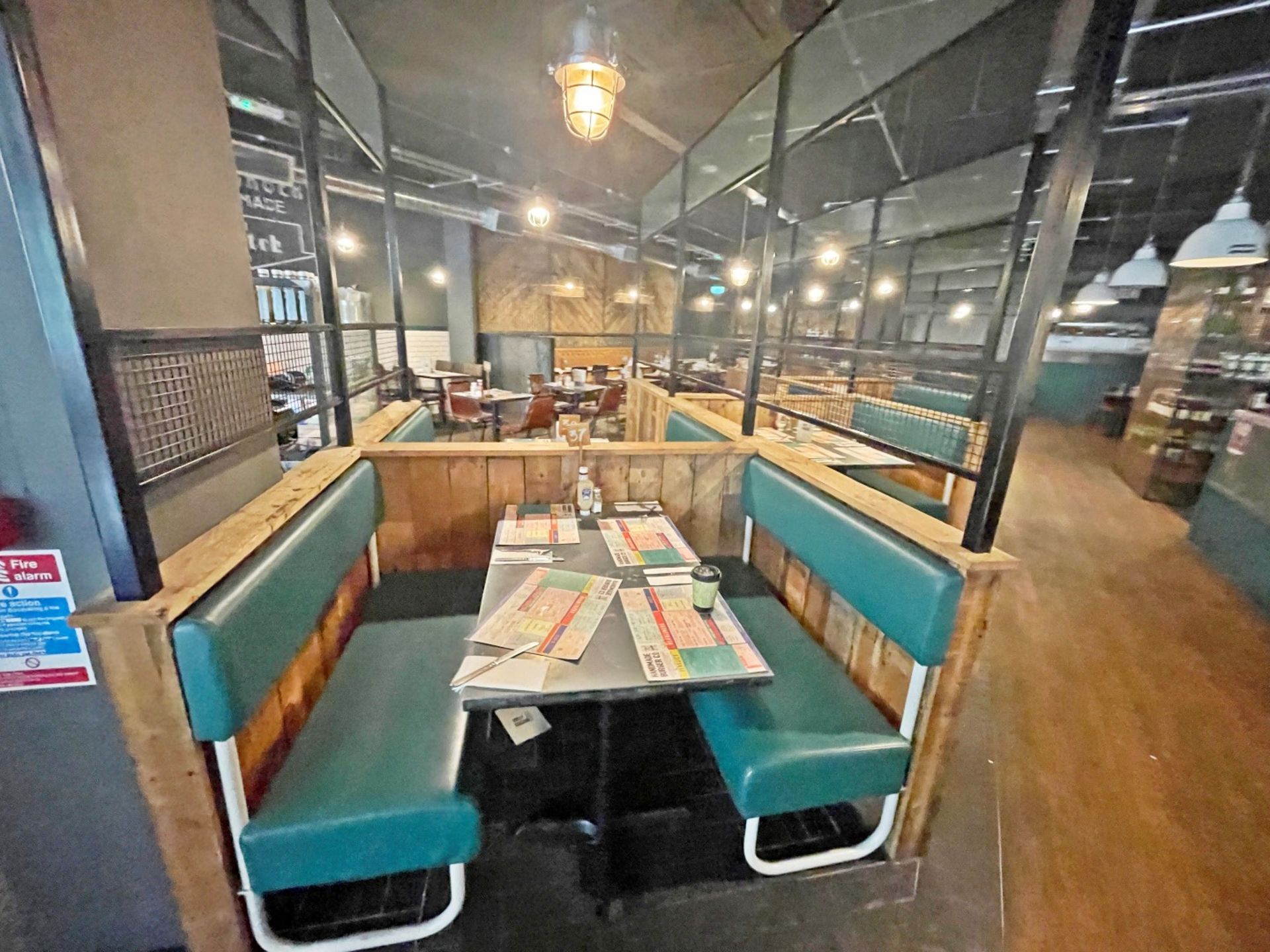 Large Seating Booth Area Featuring Rustic Wood Dividers Under Industrial Style Height Extenders - Image 24 of 27