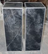 A Pair Of Display Plinths With A Black Marble Effect Finish And Brushed Silver Trim - Specially