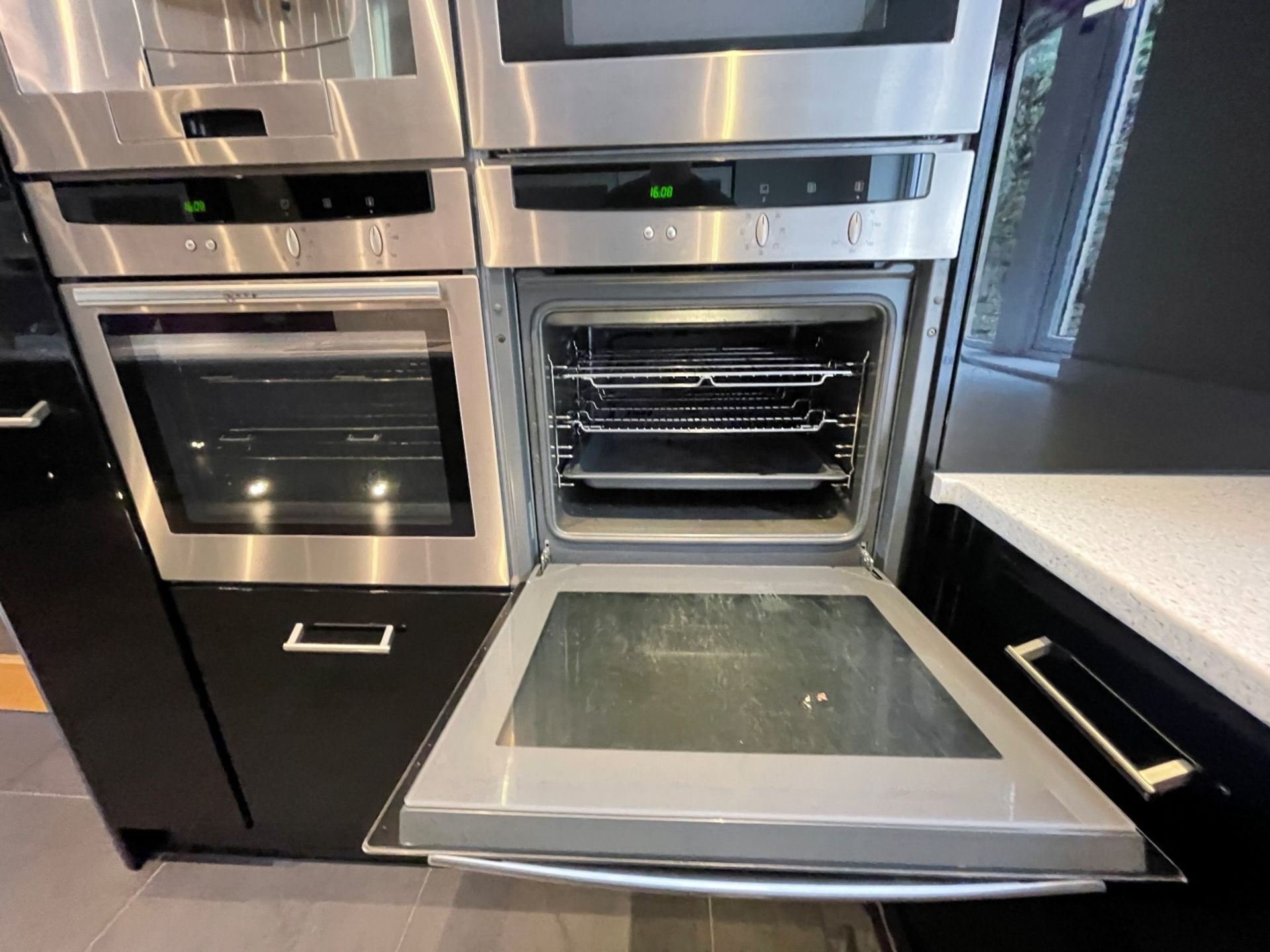 1 x MAGNET Modern Black Gloss Fitted Kitchen With Premium Branded Appliances + Corian Worktops - Image 9 of 62