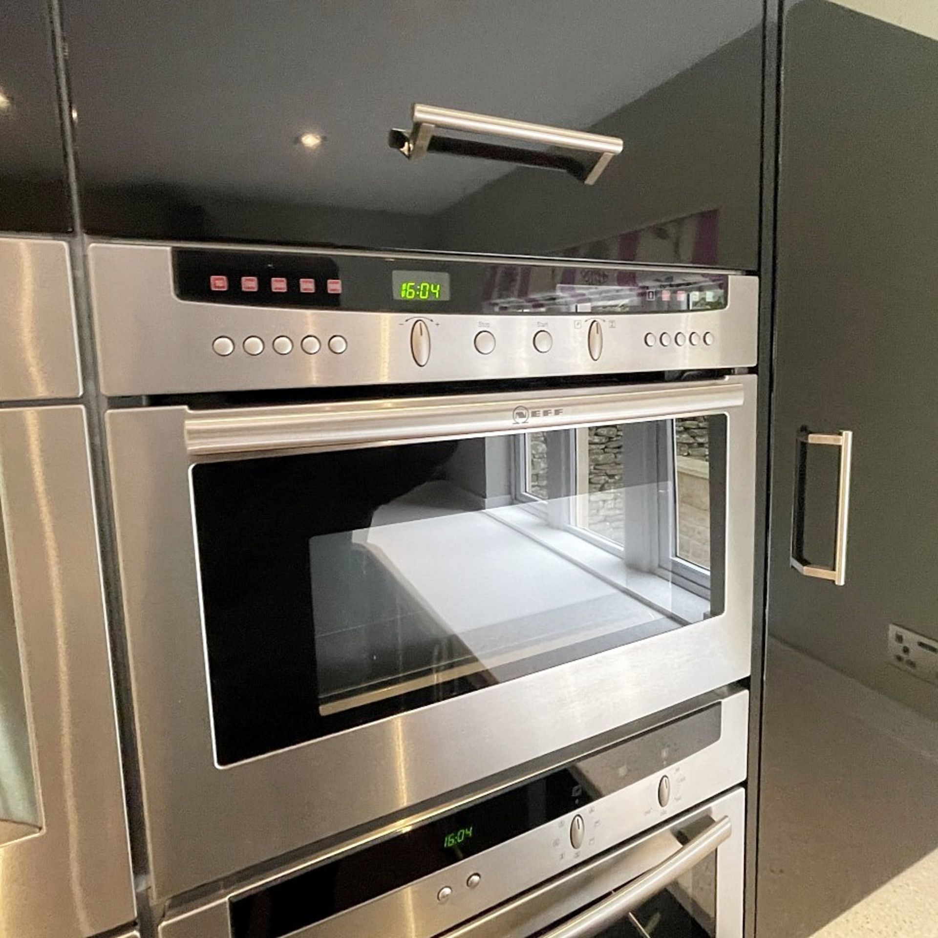 1 x MAGNET Modern Black Gloss Fitted Kitchen With Premium Branded Appliances + Corian Worktops - Image 24 of 62