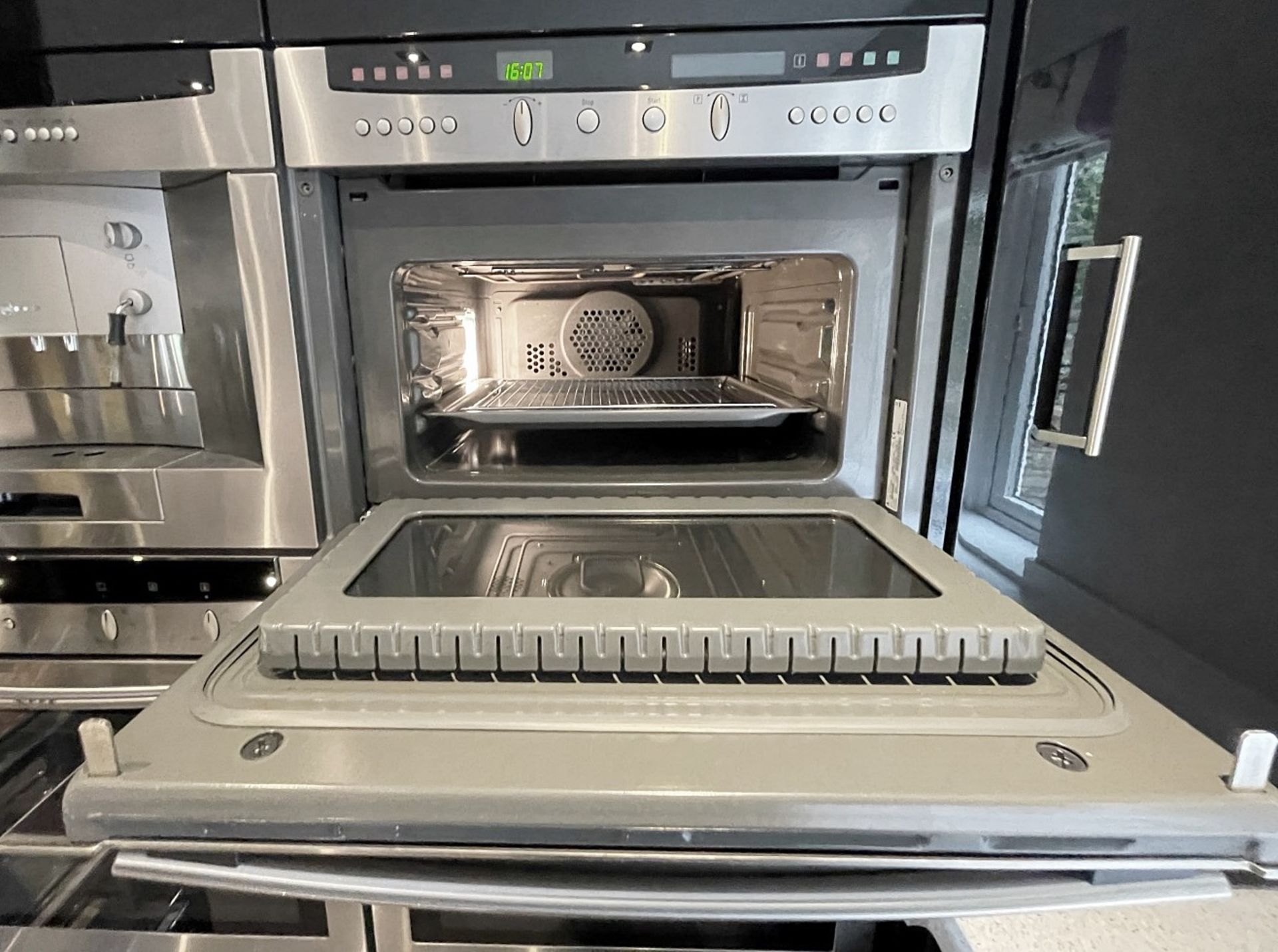 1 x MAGNET Modern Black Gloss Fitted Kitchen With Premium Branded Appliances + Corian Worktops - Image 44 of 62