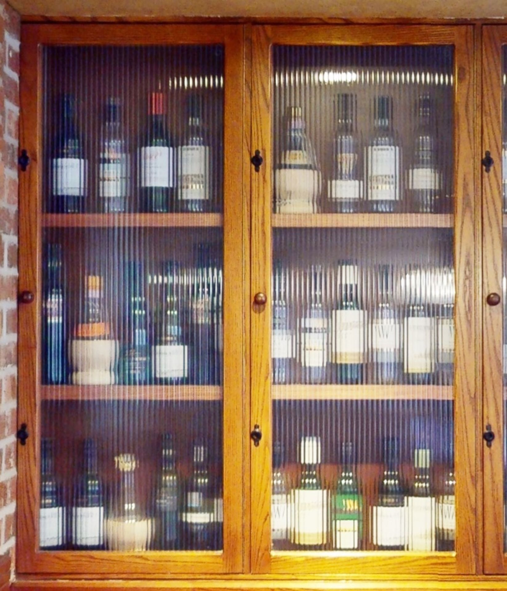 1 x Illuminated Wine Bottle Display Cabinet With Ribbed Glass Doors - Wooden Carcass With Five Doors - Image 3 of 3