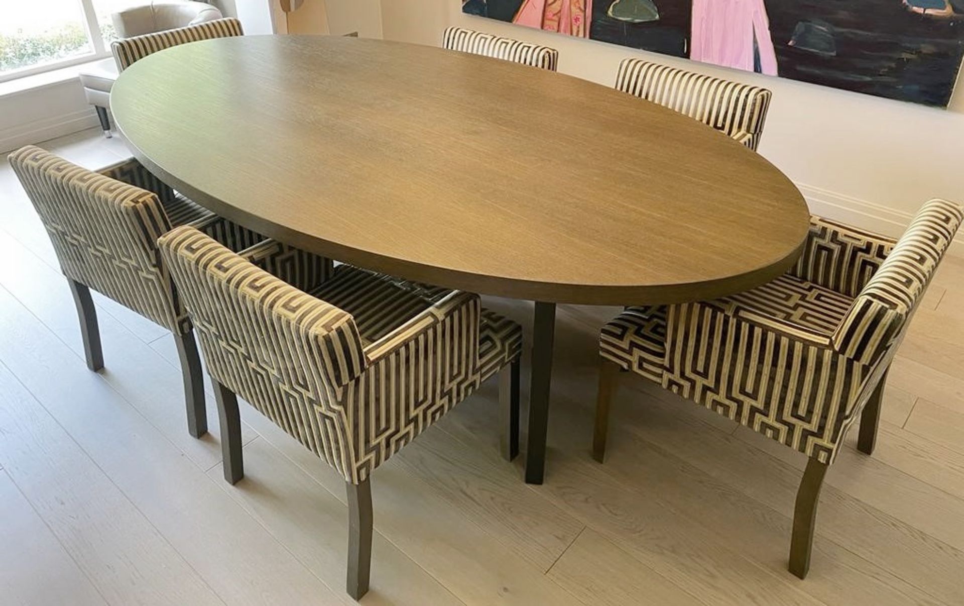 1 x Oval Dining Table With A Limed Oak Finish And Metal Legs