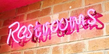 1 x Pink Neon 'Restrooms' Wall Sign - Approx 70cm Long - From a Popular American Diner