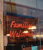 1 x 'FAMILIES WELCOME' Illuminated Restaurant Sign - Size: W70 x H56cm / 60cm Drop - From a