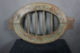 Oval window in wood and wrought iron H50x64