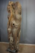 Decorative sculpture in wood with 3 faces