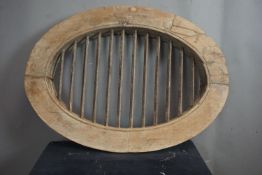 Oval window in wood and wrought iron H65x90