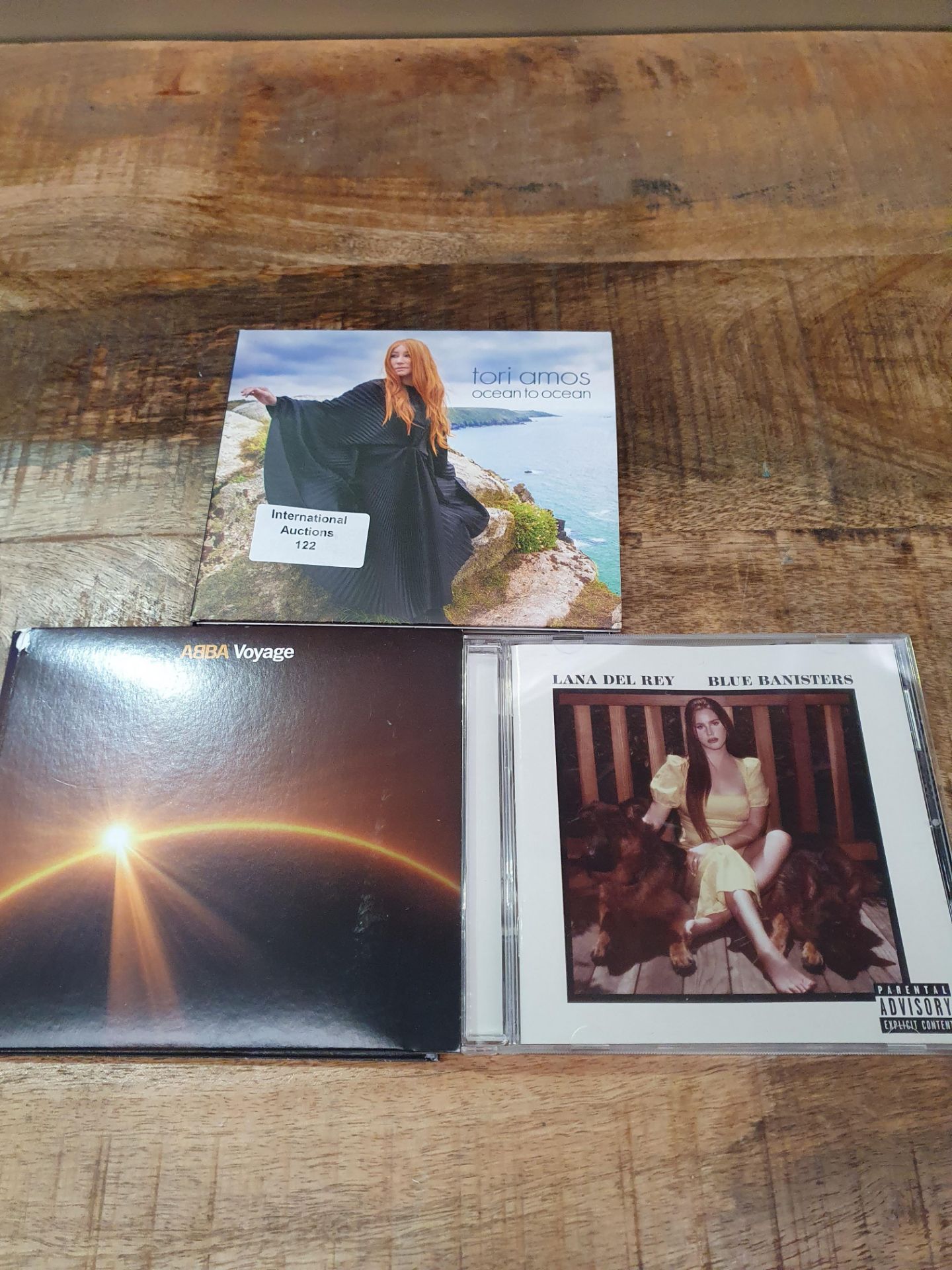 X 3 ITEMS TO INCLUDE LANA DEL RAY, ABBA VOYAGE, TORI AMOS