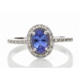18ct White Gold Diamond And Tanzanite Halo Setting Ring 0.15 Carats - Valued by GIE £4,850.00 - A