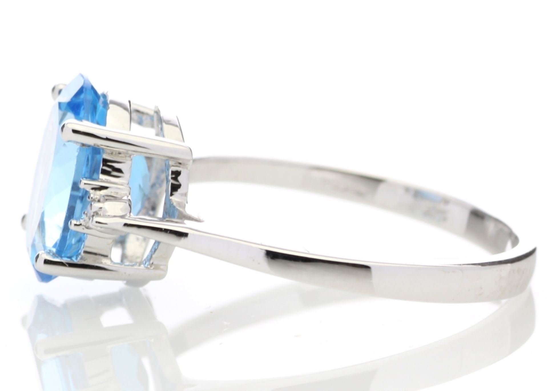 9ct White Gold Diamond And Blue Topaz Ring 0.01 Carats - Valued by AGI £835.00 - An oval cut Blue - Image 3 of 5