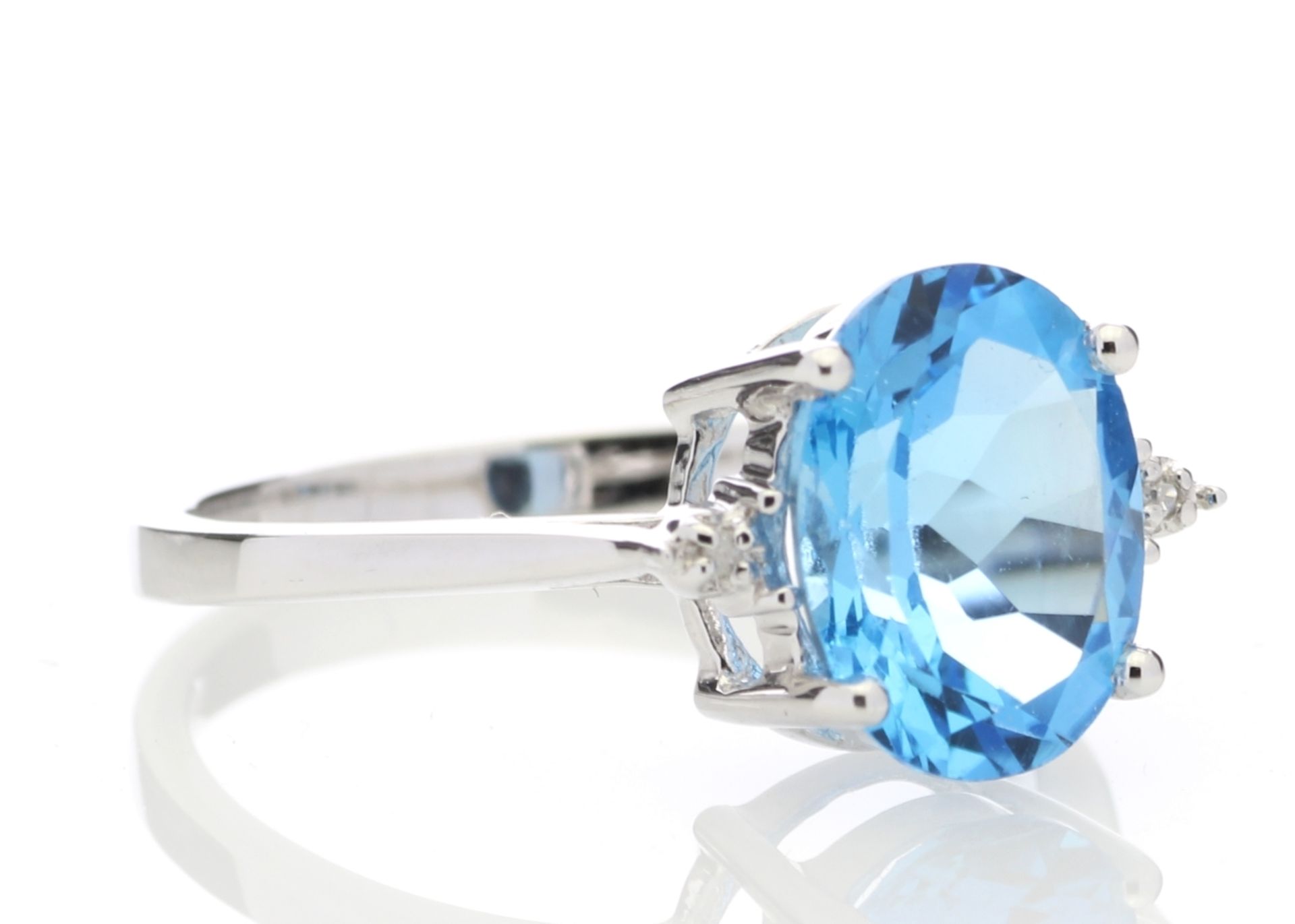 9ct White Gold Diamond And Blue Topaz Ring 0.01 Carats - Valued by AGI £835.00 - An oval cut Blue - Image 4 of 5