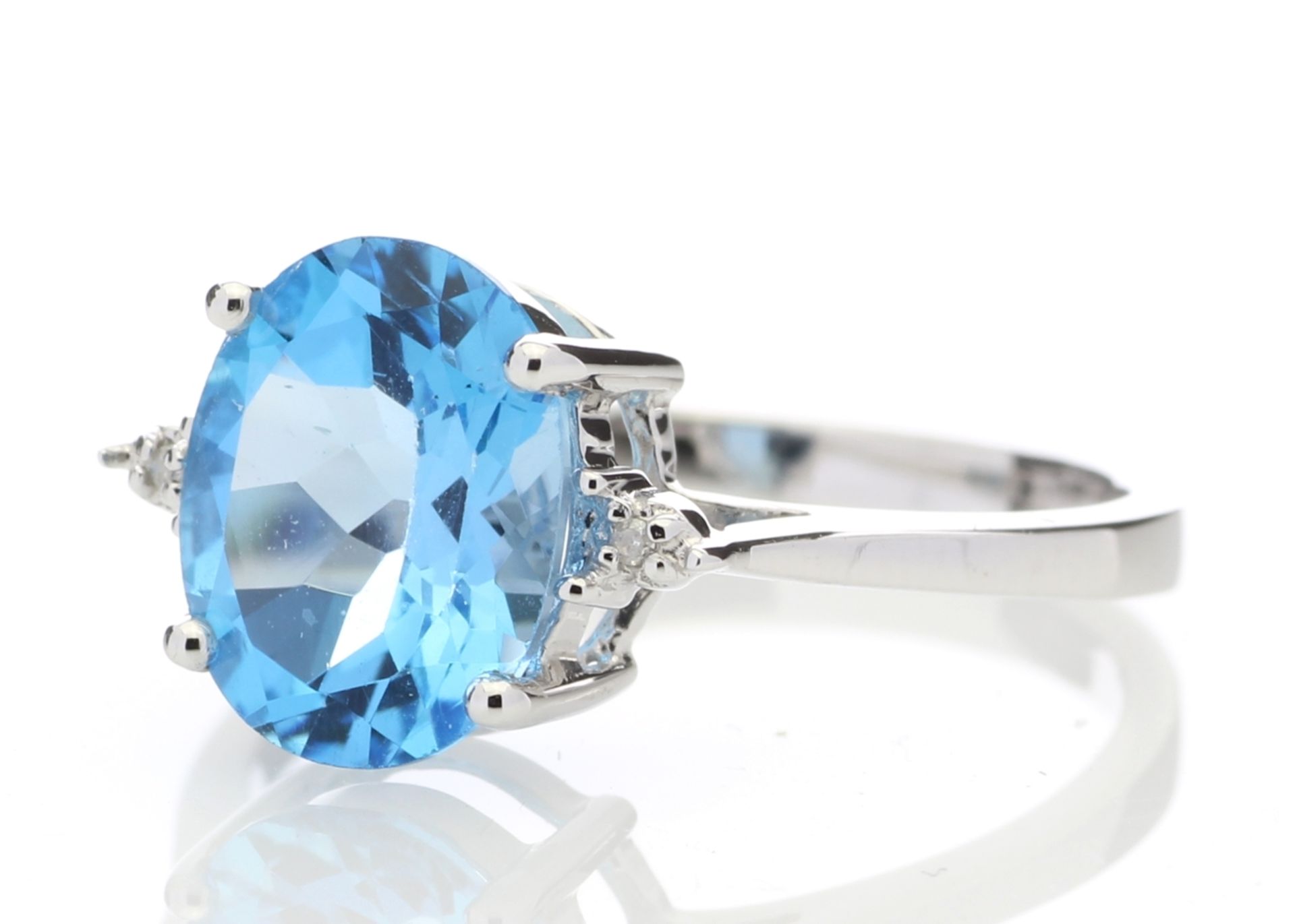 9ct White Gold Diamond And Blue Topaz Ring 0.01 Carats - Valued by AGI £835.00 - An oval cut Blue - Image 2 of 5