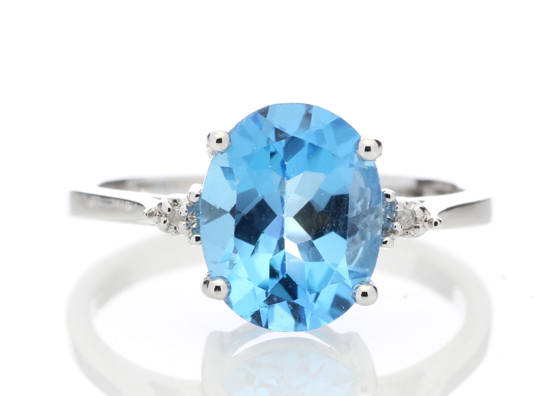 9ct White Gold Diamond And Blue Topaz Ring 0.01 Carats - Valued by AGI £835.00 - An oval cut Blue