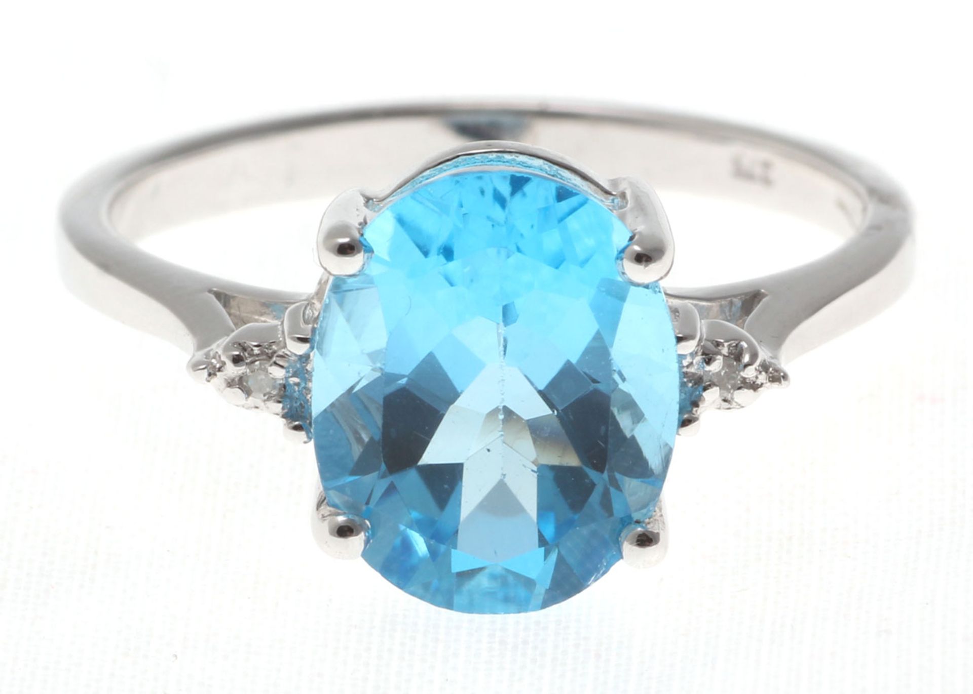 9ct White Gold Diamond And Blue Topaz Ring 0.01 Carats - Valued by AGI £835.00 - An oval cut Blue - Image 5 of 5