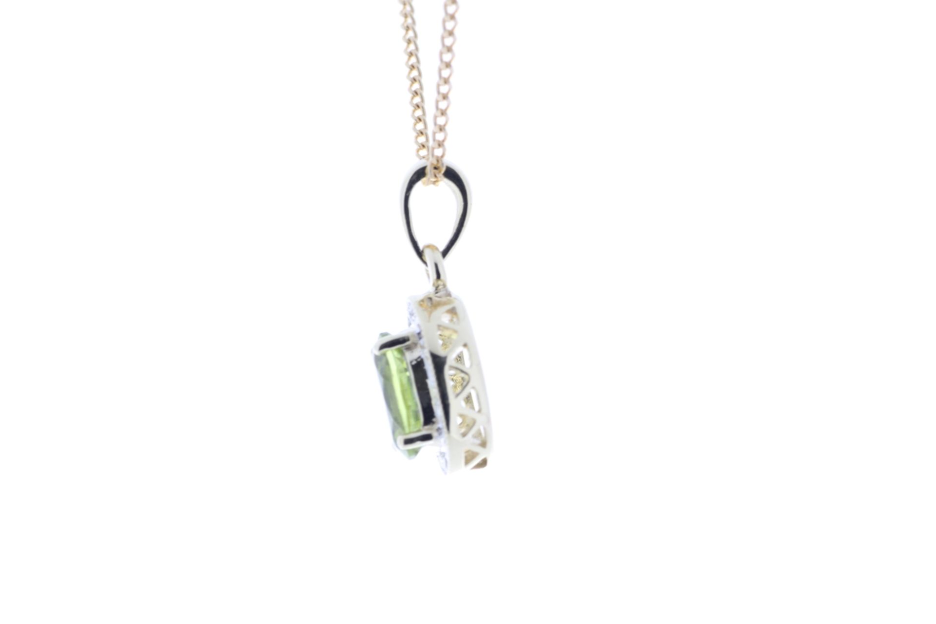 9ct Yellow Gold Diamond And Peridot Pendant (P 0.75) 0.11 Carats - Valued By IDI £1,870.00 - An oval - Image 3 of 4