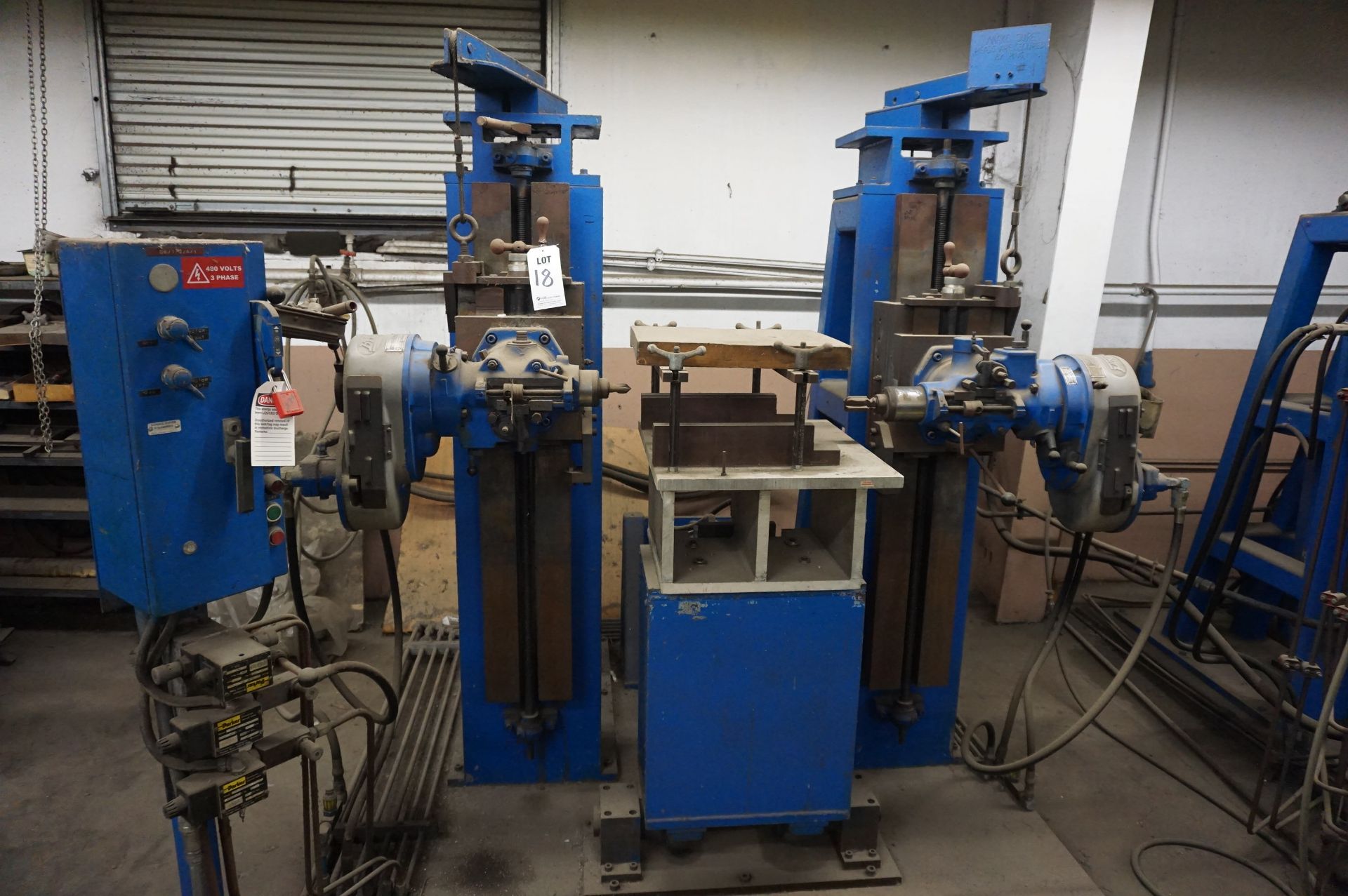 MACHINE ASSEMBLY TO INCLUDE: (2) BRIDGEPORT MILLING HEADS, PULLEY SYSTEM AND TRACKS, CONTROL, 480