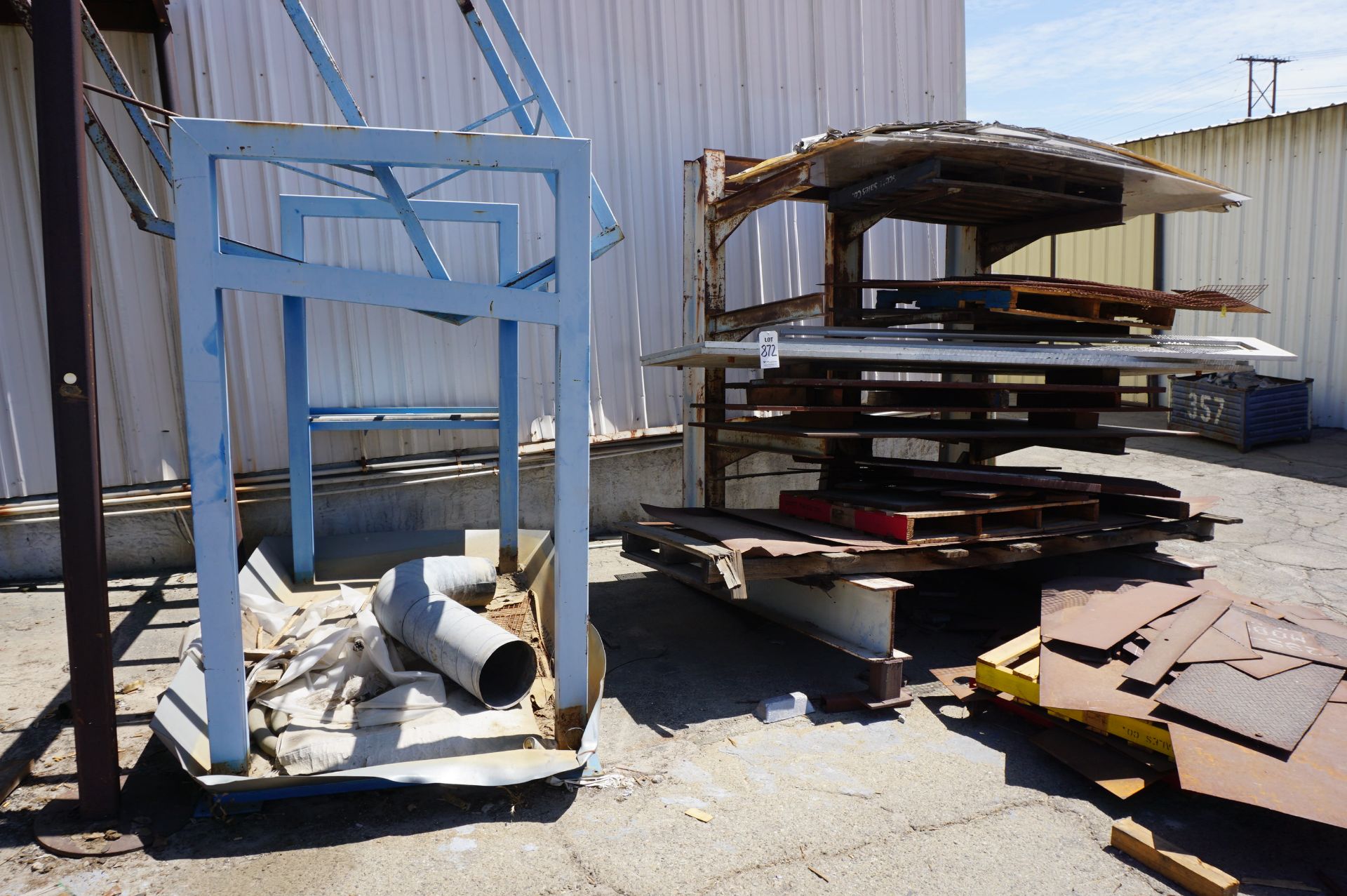 MATERIAL RACK WITH CONTENTS TO INCLUDE: MISC. ALUMINUM AND STEEL PLATES **Rigging provided