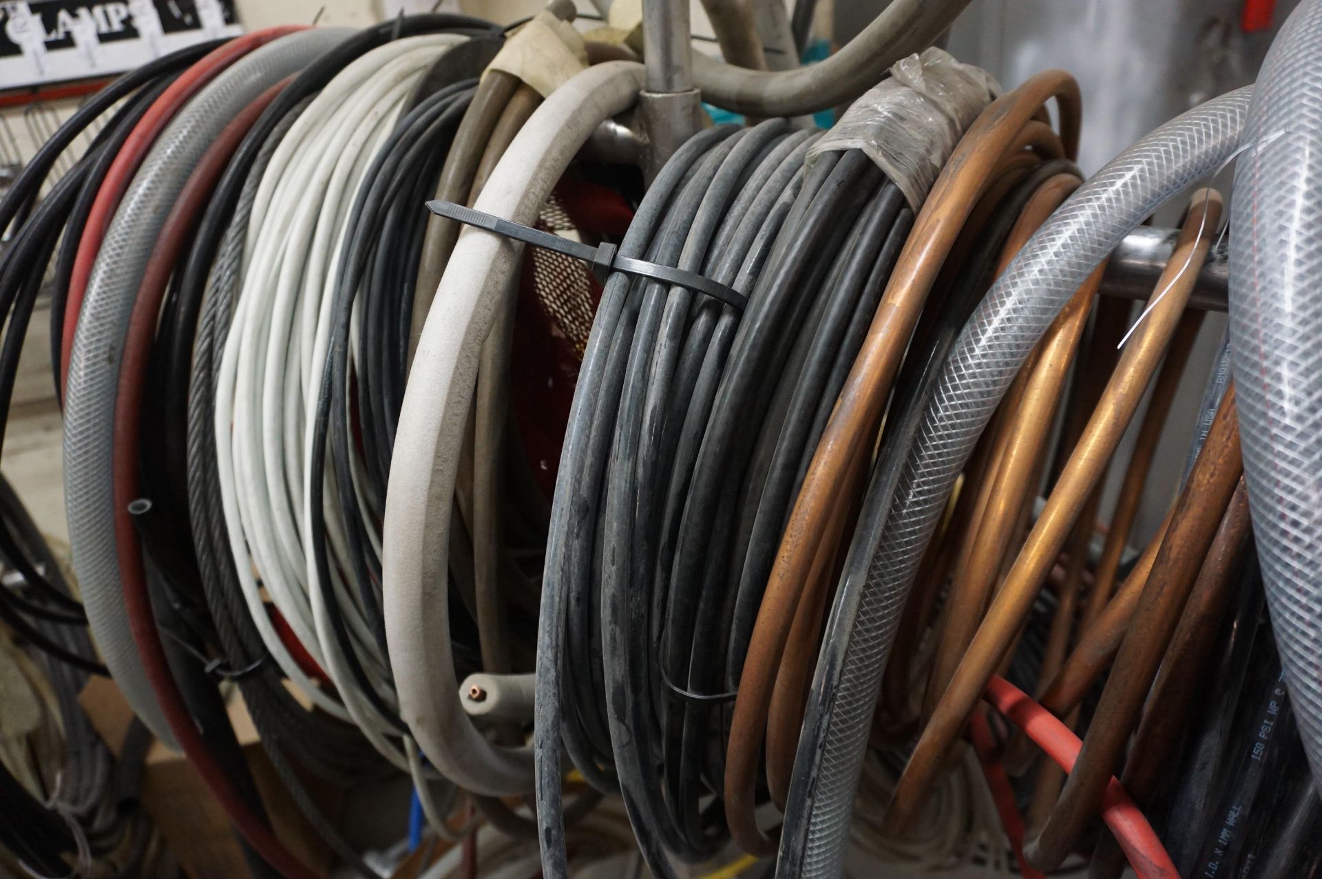 LOT TO INCLUDE: MISC. HOSES AND COPPER PIPING, HOSE SPOOLS, VARIED SIZES - Image 2 of 4