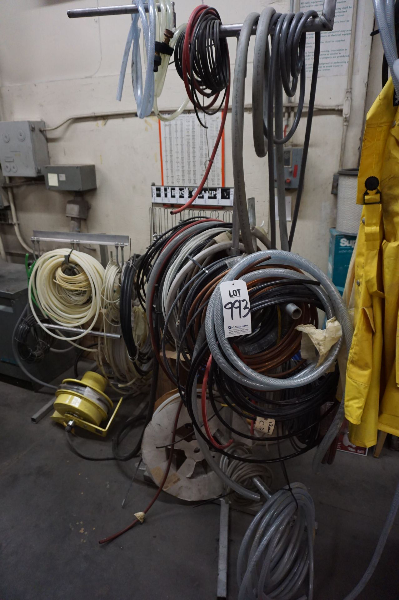 LOT TO INCLUDE: MISC. HOSES AND COPPER PIPING, HOSE SPOOLS, VARIED SIZES