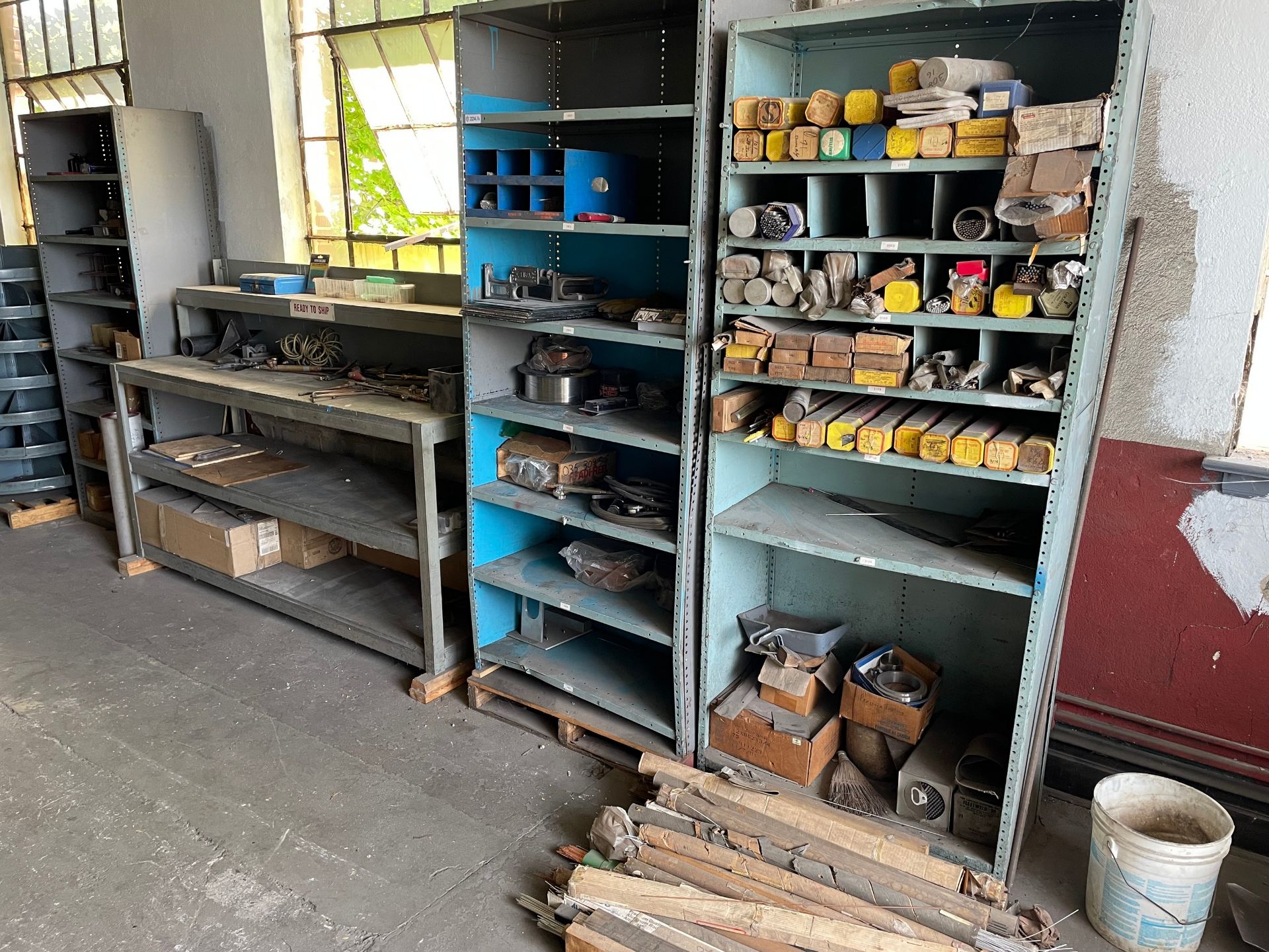 Lot with (3) Sections of Shelving and Workstation with Contents of Welding Supplies