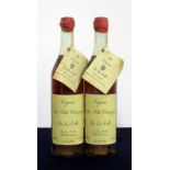 2 70-cl bts De La Motte Fine Petite Champagne Cognac 1914 bottle numbers 00090 and 00172, chipped